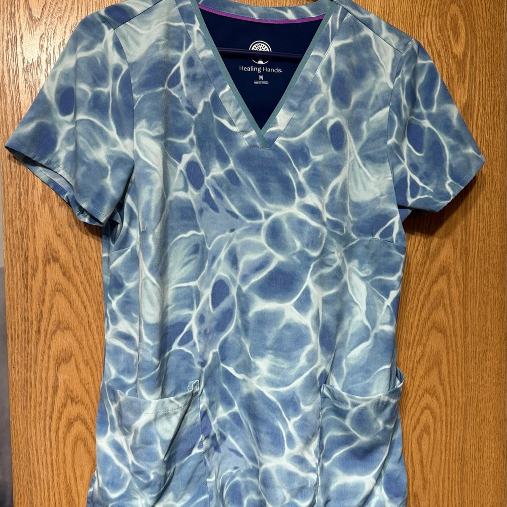[SOLD] Healing Hands Blue and Light Blue Scrub Top